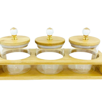 3 Glazen  voorraadpotten in een groot Bamboe frame