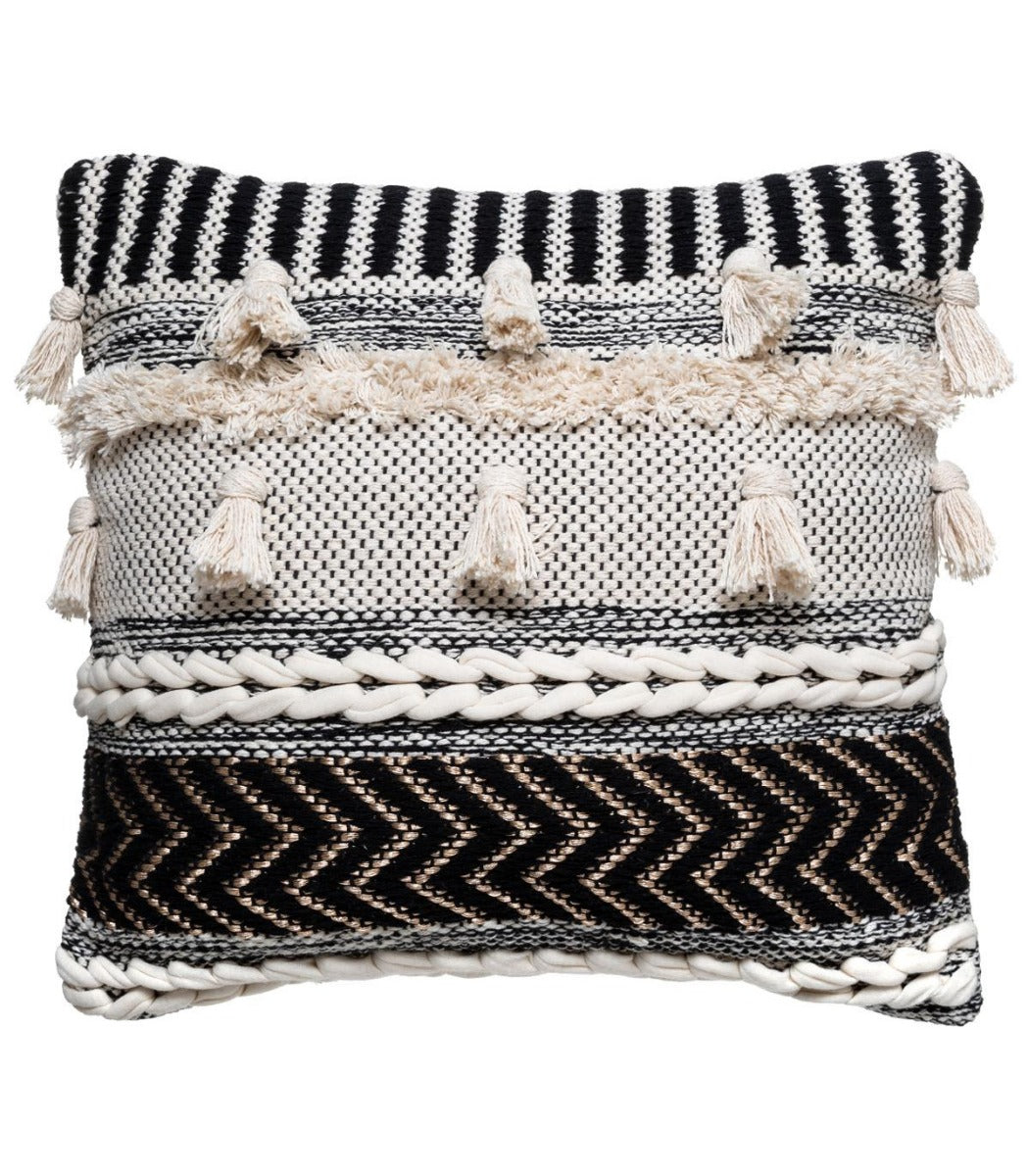 Coussin blanc et noir à motif en relief avec pompons
