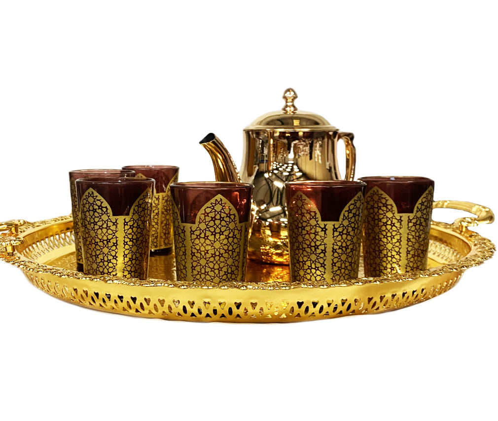 Gold tea set with colored glasses