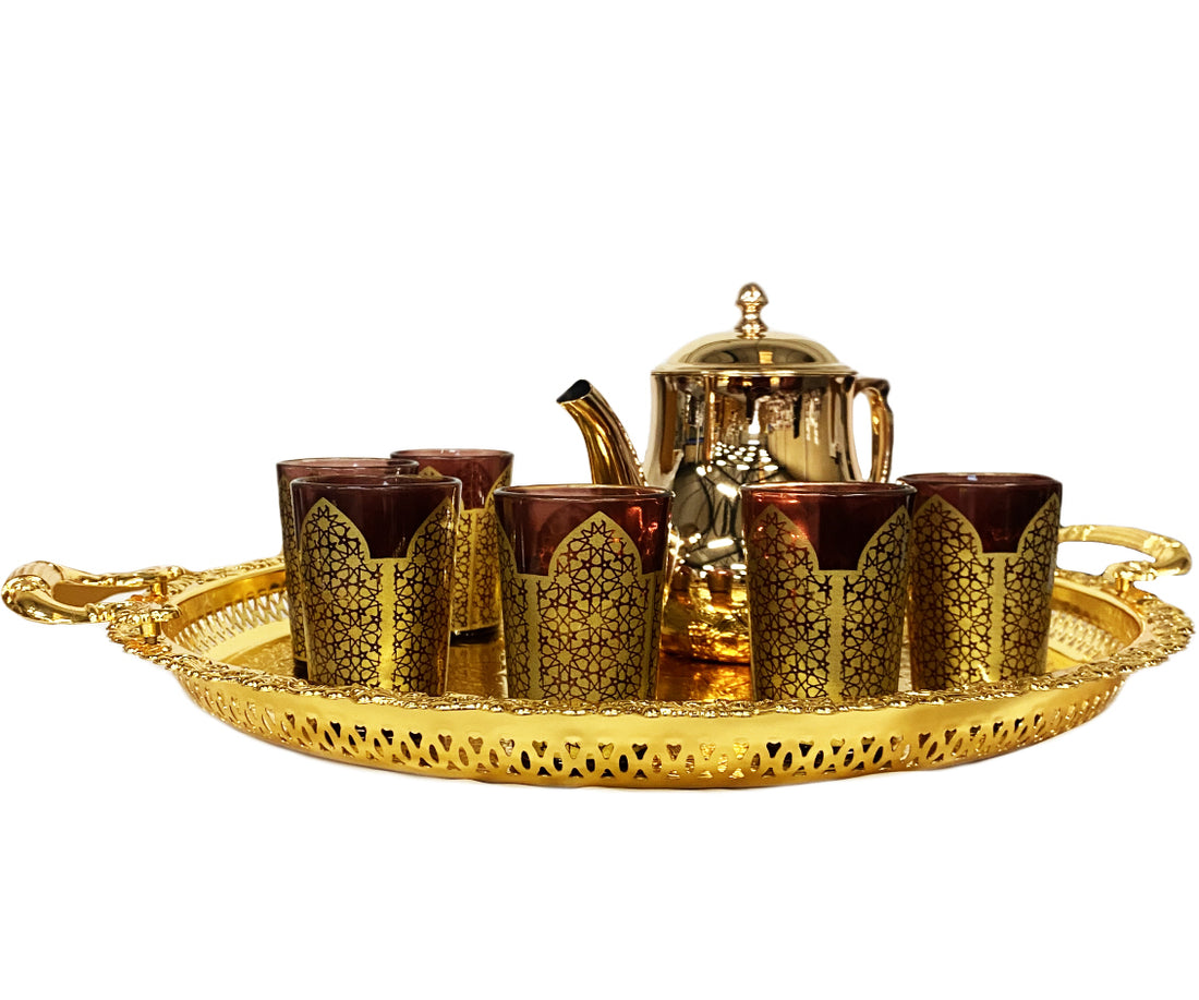 Gold tea set with colored glasses