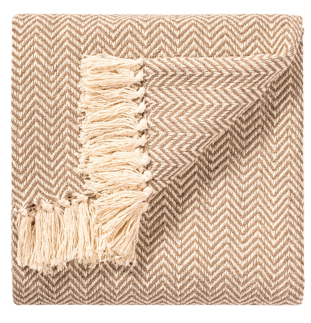 Soft hand-woven throw with tassels