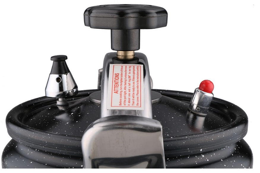 Autocuiseur noir de 11 litres avec revêtement antiadhésif façon marbre.